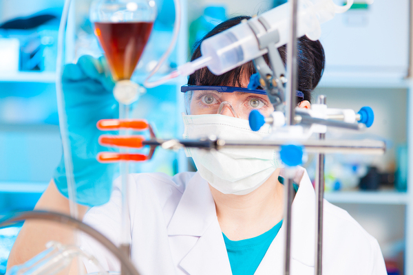 Scientist working with test tubes.